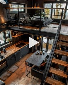 an aerial view of a loft with stairs leading up to the bedroom