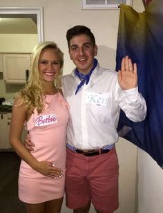 a man and woman dressed in pink posing for the camera