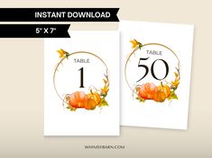 a table number card with pumpkins and leaves