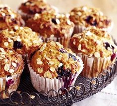 muffins with blueberries and other toppings on a plate