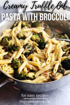 a pan filled with pasta and broccoli on top of a table