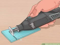 a person using a power tool on a piece of wood