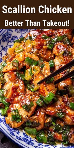 a blue and white plate topped with chicken, peppers and green onions next to chopsticks