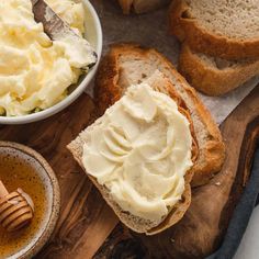 bread, butter and honey on a cutting board