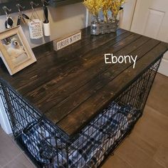 a dog crate sitting on top of a wooden table