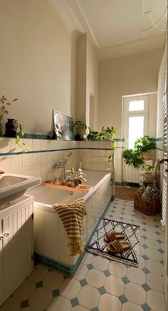 a bathroom with blue and white tiles on the floor, walls and floors is shown