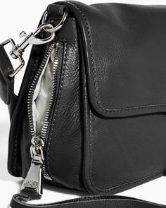 Made for everyday use, the Great Escape Crossbody is crafted with a wide variety of exterior and inside pockets for organization. Custom new hardware along the flap elevates this functional crossbody bag, offering a bold statement. Glove Tanned Leather Custom hardware Back slip pocket with magnetic closure Interior slip pocket under flap and zip pocket Detachable and adjustable strap: 41.25" - 51.25" inches 11.25"W x 6.75"H x 5.25"D Weight approximately: 1.4 lbs Everyday Flap Shoulder Bag With Gunmetal Hardware, Everyday Shoulder Bag With Gunmetal Hardware And Flap, Everyday Shoulder Bag With Gunmetal Hardware, Functional Shoulder Bag With Silver-tone Hardware, Functional Shoulder Bag With Silver-tone Hardware For Everyday Use, Crossbody Saddle Bag With Silver-tone Hardware For Travel, Travel Crossbody Saddle Bag With Silver-tone Hardware, Functional Rectangular Bag With Silver-tone Hardware, Travel Flap Bag With Silver-tone Hardware