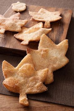 some cookies are on a wooden cutting board