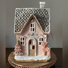 a gingerbread house decorated with icing and decorations