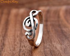 9mm Solid 925 Sterling Silver Treble Clef Musical Symbol Ring ▷Gift Box Included ▷9mm Height ▷Size 4 - 10 Available ▷925 Sterling Silver (not plated or filled) ▷925 Stamp Authenticity https://www.etsy.com/shop/TrendyRing Silver Music-themed Rings For Gifts, Music-themed Silver Ring As A Gift, Music-themed Silver Rings As Gifts, Music-themed Silver Rings For Gifts, Music-themed Silver Rings For Gift, Music Note Ring, Treble Clef, Music Note, Silver Jewelry Rings