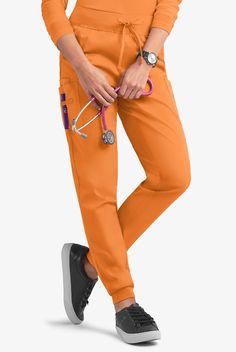 Joggers are the next-best thing to wearing your favorite sweats to work. Our drawstring scrub pants have cargo pockets for maximum storage and a wide knit waistband that is as comfy as it is flattering. Each piece in our Butter-soft Stretch scrub collection was designed for 12+ hour shifts, and made from easy-care, 2-way stretch comfort fabric. • Classic fit • Natural waisted • Knit drawstring waistband • Tapered leg • Jogger • Total of 5 pockets • 2 front pockets • 2 cargo pockets • 1 cell phon Apricot Crush, Scrub Collection, 12 Hour Shifts, Uniform Advantage, Medical Uniforms, Cargo Joggers, Athleisure Fashion, Scrub Pants, Drawstring Waistband