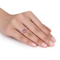 When it comes to romantic celebrations, this Morganite, Pink Tourmaline and Diamond Accent Heart Ring is the perfect choice. The rose plated sterling silver ring sparkles with the rosy hues of a heart-shaped, prong-set morganite (7mm) framed by 16 round, prong-set pink tourmalines (1.5mm). Two round, prong-set diamonds (G-H, I2-I3) twinkle at the cross-over-style band. Rose Gold Solitaire Ring For Valentine's Day, Rose Gold Heart Ring, Round Cut, Fine Jewelry, Rose Gold Round Cut Heart Ring In Fine Jewelry, Rose Gold Round Cut Heart Ring, Rose Gold Rings With Heart-cut Rose Diamonds, Rose Gold Heart Cut Rings With Rose Cut Diamonds, Rose Gold Heart Cut Jewelry With Accent Stones, Pink Gold Fine Jewelry Rings For Valentine's Day, Valentine's Day Rose Gold Fine Jewelry Heart Ring