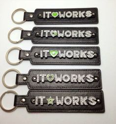 four black leather key chains with words on them that say it works, it works and it works