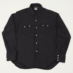 Based on the American motorcycle culture of the 1950s and 1960s, this fantastic, deep black western shirt from Freewheelers offers a slimmer fit which keeps the piece understated. With a simplistic collar and yoke, and stitching with the same black colour, the shirt is easier to style than a traditional western shirt without removing the essence of the style. Made from 100% rayon, the shimmery fabric is accented by bright white snap buttons on the front, pockets, and cuffs. It's crucial to note that as this piece is made of rayon, we would recommend keeping away from water and dry cleaning to avoid shrinkage! 100% rayon fabric Slim fit Traditional western shape Shimmery fabric White snap closures Motor Psyclone tag Product code: 2423002 Made in Japan Workwear Boots, Denim Repair, Wing Shoes, Motorcycle Culture, Red Wing Shoes, Ivy Style, Vintage Sneakers, Selvedge Denim, Lacing Sneakers