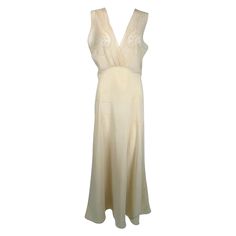 1930s cream bias cut sheer silk hand embroidered & appliqued slip dress gown. Beautiful sheer silk gown in pale cream. The cross over bodice has inset sheer silk panels at the bust, each with delicate applique & embroidery. The gown has a high waist, the bias skirt is fitted through the hips & flairs at the hem. Fits like a size medium. In excellent wearable condition. All our clothing is dry cleaned and inspected for condition and is ready to wear. Any condition issues will be noted. For visual Bias Skirt, Lace Tunic Dress, Color Crema, Maxi Gown Dress, Costume Institute, Silk Gown, Dress Gown, Silk Chiffon, The Cross