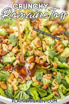 broccoli salad with walnuts and dressing being drizzled on top