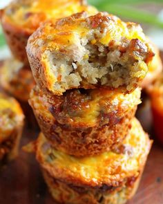 there are several muffins stacked on top of each other with cheese and meat