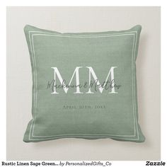 a green pillow with the word mr and mrs on it, in white lettering that reads