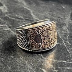 Silver Ottoman Crest Calligraphy Design Ring , Handmade Engraved Ottoman Ring , Ottoman Coat of Arms Men Ring , Patriotic Jewelry , Gift For Him , Same Day For Shipping ✧ Product Details * Handmade İtem * Gender : Male / Female * Material : 925K Sterling Silver * Ring Weight : 10 Grams ✔ Usage Details * Silver jewelry is very sensitive to chemicals. It is recommended to keep away from chemical substances such as cream, bleach, deodorant, detergent. * Silver jewelry can also darken quickly in salt water, that is, in sea water. For this reason, it is best to remove them when swimming in the sea. ✔ Shipping * Your orders placed on weekdays are delivered to the cargo on the same day. Your orders placed on the weekend are delivered to the cargo on Monday. ✔ Other Details * Our products are hand Traditional Engraved White Gold Signet Ring, Traditional Engraved Ring With Engraving Option, Traditional Engraved Signet Ring For Formal Occasions, Traditional Engraved Signet Ring For Anniversary, Traditional Stamped 925 Engraved Ring For Ceremonial Occasions, Traditional Etched White Gold Rings, Traditional Engraved Signet Ring Collectible, Traditional Formal Engraved Ring Stamped 925, Traditional Rings With Engraving Option As Gift