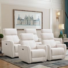 three white recliners sitting on top of a rug