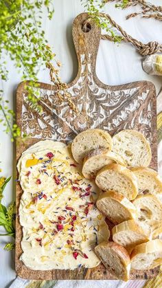 bread and cheese spread on a cutting board