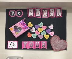 a bulletin board with candy, candies and hearts on it that says be sweet to your teacher