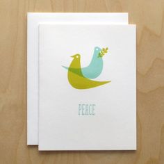 a card with two birds on it and the words peace in green, yellow and blue