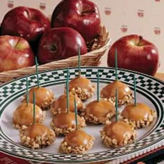 apples and peanut butter are on a plate with toothpicks in the shape of an oatmeal