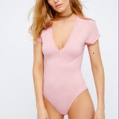 Brand New With Tag. Comfortable Bodysuit By Free People Features "V" Neck, Short Sleeves And Snap Bottom Closure. 95% Rayon, 5% Spandex Trendy V-neck Bodysuit For Loungewear, Casual V-neck Bodysuit For Spring, Casual V-neck Bodysuit For Loungewear, Pink Fitted V-neck Bodysuit, Summer Short Sleeve Bodysuit For Loungewear, Pink Short Sleeve Bodysuit For Summer, Casual Pink Short Sleeve Bodysuit For Summer, Solid Short Sleeve Bodysuit For Spring Loungewear, Summer V-neck Solid Color Short Sleeve Bodysuit