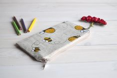 "Bees pencil case, Pencil Pouch, Cosmetic pouch, Make Up Pouch, Charger bag, Project bag, Travel bag, Bridesmaid gift, Bridal purse, Toiletery bag, Bridal clutch You can carry and any other sorts, like cosmetics, pencils or whatever you see fit. *If you want other size or fabric contact me via Etsy conversation length - 3.5\" (9 cm); width - at the zipper top 7\" (17 cm); width - 7,6\" (19,5 cm). Exterior fabric: beige, black, yellow, white* linen 58 %, cotton 42 % (the print placement on the fa Beige Pencil Case With Pen Holders, Beige Pencil Case With Pen Slots, Beige Pencil Case With Pen Holders As Gift, Beige Pencil Case With Zipper As Gift, Beige Zipper Pencil Case As A Gift, Cute Pencil-shaped Cosmetic Bag For Gifts, Cute Pencil-shaped Cosmetic Bag Gift, Cute Pencil Shaped Cosmetic Bag Gift, Handmade Pouch Pencil Case For School