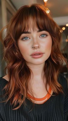 28 Exquisite Feathered Haircut Ideas for All Hair Types Long hair with bangs Medium Layers Haircuts With Bangs, Red Heads With Bangs, 70s Bangs Hairstyles, Medium Shag With Wispy Bangs, Red Hair With Bangs And Layers, Wispy Bangs Medium Length Hair, Feathered Bangs Short Hair, Wispy Bangs Red Hair, Front Bangs With Medium Hair