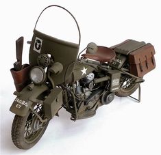 a toy motorcycle with a side car on it's back tire and saddlebag attached to the seat