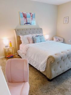 a bedroom with a bed, chair and pictures on the wall above it's headboard