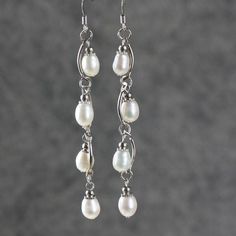 These wavy long dangle earrings are handmade using fresh water pearls. Perfect gift for any occasion! Free U.S shipping! Anni Designs. Customers who purchased this item said: Fast Shipping and great prices. Loved them ~ so pretty Received the earrings yesterday and they are beautiful - Pearls Wirework Jewelry, Black Pearl Earrings, Earrings Ideas, Beaded Earring, Handmade Jewelry Earrings, Beaded Jewellery, Ceramic Earring, Jewelry Personalized, Spiral Earrings