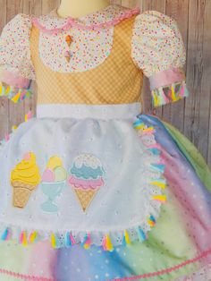 This is a beautiful Ice cream dress for your little one will look gorgeous in this dress, is perfect for a birthday ice cream party. The dress is made with 100% cotton fabric and all attention to detail This dress is made with 2 skirt layers, it has a ice cream appliqué that looks so cute on the dress just perfect for your little angel. The Dress is available from sizes 2 -8 years. Girls size Chest 2T 19'' 3T 21'' 4T 22'' 5T 23'' 6 24'' I use an underskirt just to show how puffy is the dress. if Ice Cream Applique, Ice Cream Birthday Party Outfit, Cream Birthday Dress, Ice Cream Outfit, Beautiful Ice Cream, Ice Cream Dress, Skirt Layers, Cotton Candy Dress, Ice Cream Kids