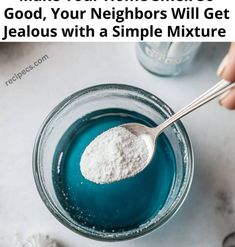 someone is spooning some blue liquid into a glass with the words make your home smell good, your neighbors will get jellous with a simple mixture