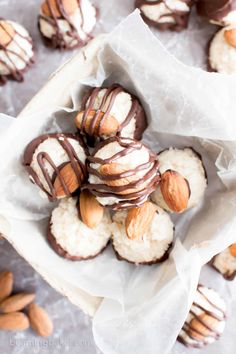 almonds and chocolate covered cookies in a bowl