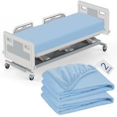 a hospital bed with blue sheets and pillows