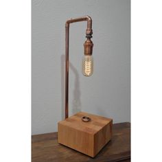 a wooden block with a light bulb on it