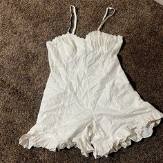 This Romper Has Never Been Worn Before, The Color Is Like A Dirty White And There Is A Lot Of Lace And Ruffles On It. Fitted Cotton Summer Jumpsuits And Rompers, Fitted Summer Cotton Jumpsuits And Rompers, Fitted Cotton Jumpsuits And Rompers For Summer, Fitted Sleeveless Jumpsuits And Rompers By Urban Outfitters, Fitted Cotton Jumpsuit For Beach, Urban Outfitters Sleeveless Cotton Jumpsuit And Romper, Sleeveless Cotton Jumpsuits And Rompers By Urban Outfitters, Sleeveless Cotton Jumpsuits From Urban Outfitters, Urban Outfitters Beach Jumpsuits And Rompers For Spring