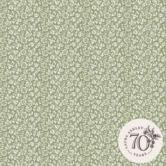 a green and white wallpaper with an image of the seventyth anniversary logo on it