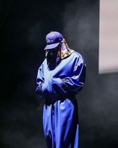 a person in a blue outfit on stage