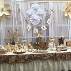 a table topped with lots of different types of cakes and cupcakes on top of it