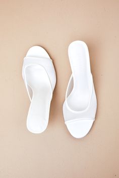 The Billini Ishi White Mesh High Heel Slide Sandals are an elegant and timeless look that'll elevate any 'fit! Smooth faux leather shapes a rounded footbed with a tapered, sheer mesh vamp with a low-cut collar. The effortless slide-on design completes the mule-style silhouette, all atop a flirty stiletto heel. Available in whole sizes only. 3" wrapped stiletto heel. Cushioned insole. Rubber sole has nonskid markings. Man Made Materials. Imported. Lulus | Ishi White Mesh High Heel Slide Sandal Heels | Size 7. Affordable White Toe Post Heels, Summer Open Toe Mesh Heels, Elegant Open Toe Mesh Sandals, Spring Open Toe Mesh Heels, Elegant Mesh Sandals For Spring, Spring Mesh Open Toe Heels, White Synthetic Sandals With Clear Strap, Synthetic Sandals With Pointed Toe And Contrasting Heel Counter, White High Heel Sandals With Clear Strap