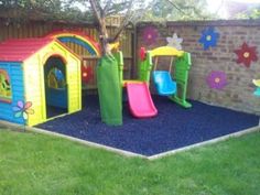 children's play area with slide and climbing wall