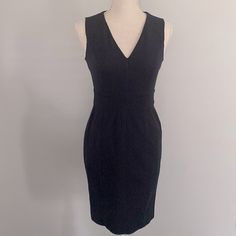 New With Tags Banana Republic Dark Blue Sleeveless Dress Size 0p Banded Waist, Skirt Length Is Approximately 19.25 Inches From Waist (Bottom Of Banding) To Bottom Of Dress. Slit In Back Of Dress For Movement (4 Inches). Hidden Zipper In Back. Sleeveless, V-Neck. Ribbing Detail. Dark, Dark Blue, Almost Black Color. No Lining: 60% Cotton, 35% Rayon, 5% Spandex. Thick Material, With A Stretch. Dry Clean Only. Dark Navy Blue Dress, Conservative Dresses, Blue Ruffle Dress, Velvet Tunic, Striped Shift Dress, Handkerchief Dress, Ruffle Trim Dress, Shimmer Dress, Midi Shift Dress