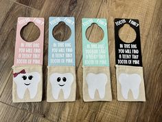 three toothbrush holders with funny sayings on them sitting on a wooden floor next to each other