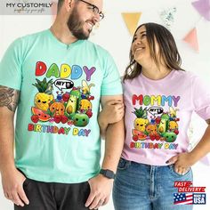 a man and woman standing next to each other wearing matching tshirts that say happy birthday