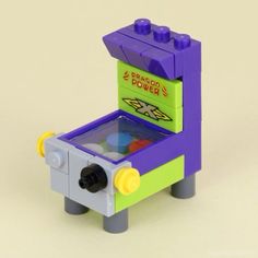 a lego toy that is made to look like an arcade game machine with buttons on it