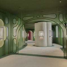 a room with green and white walls and flooring that has circles on the wall